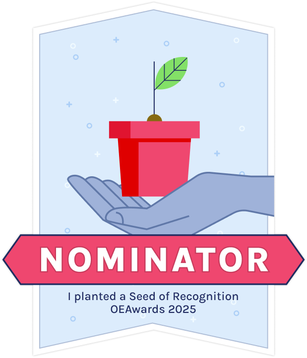 badge of a sprout on a pot held by a hand